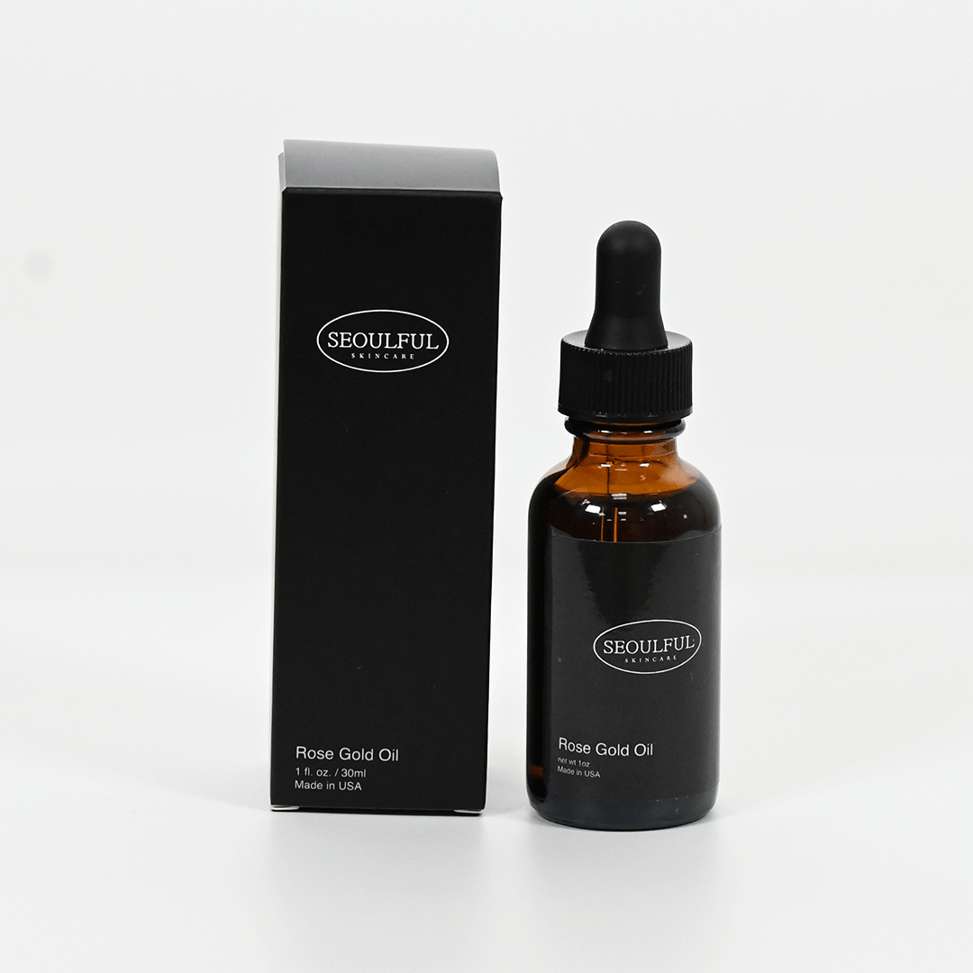 Seoulful Rose Gold Oil bottle with dropper and packaging on a white background