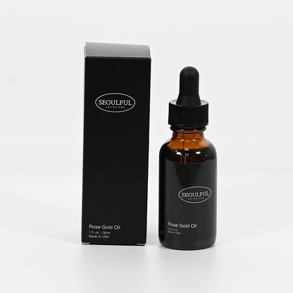 Seoulful Rose Gold Oil bottle with dropper and packaging on a white background